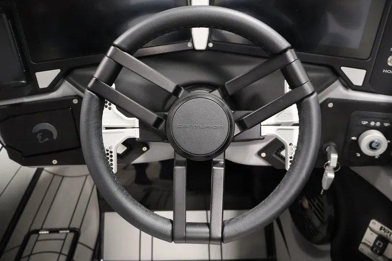 Slide: The Image of Steering wheel of 2026 Centurion Ri245 boat, featuring modern controls and sleek design. - 16