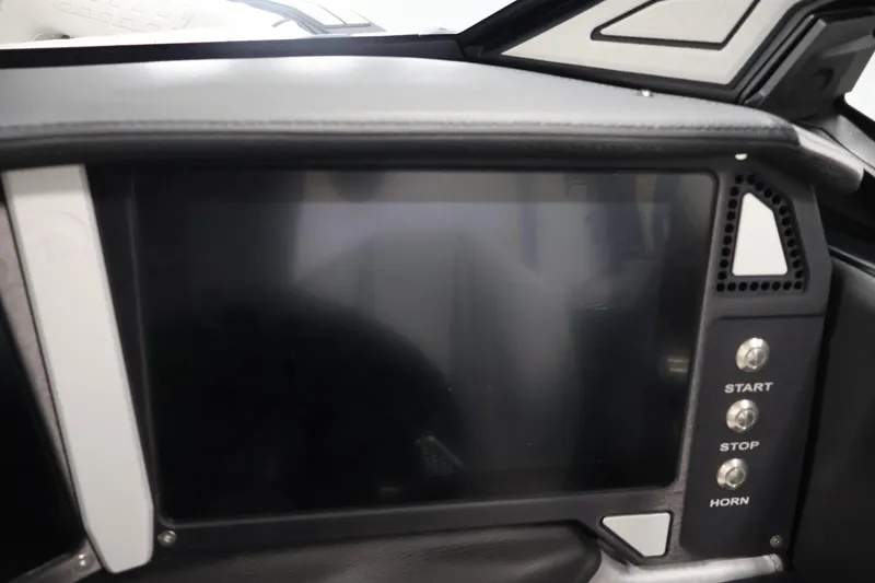 Slide: The Image of Dashboard of a 2026 Centurion Ri245 boat with touchscreen and control buttons. - 18