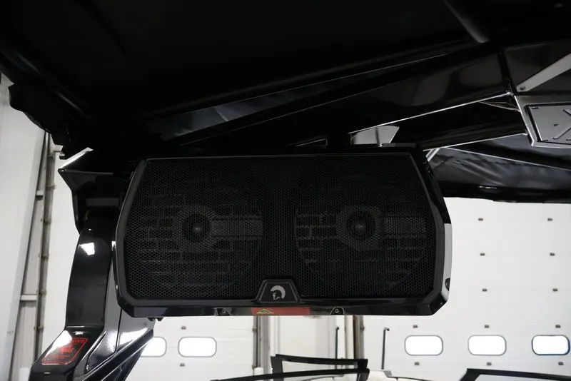 Slide: The Image of Speaker system on a 2026 Centurion Ri245 boat, mounted under a black canopy. - 40