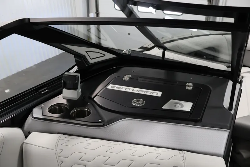 Slide: The Image of Interior of 2026 Centurion Ri245 boat with sleek dashboard and cup holders. - 24