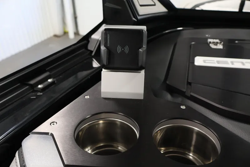 Slide: The Image of 2026 Centurion Ri245 interior with wireless charging pad and stainless steel cup holders. - 25