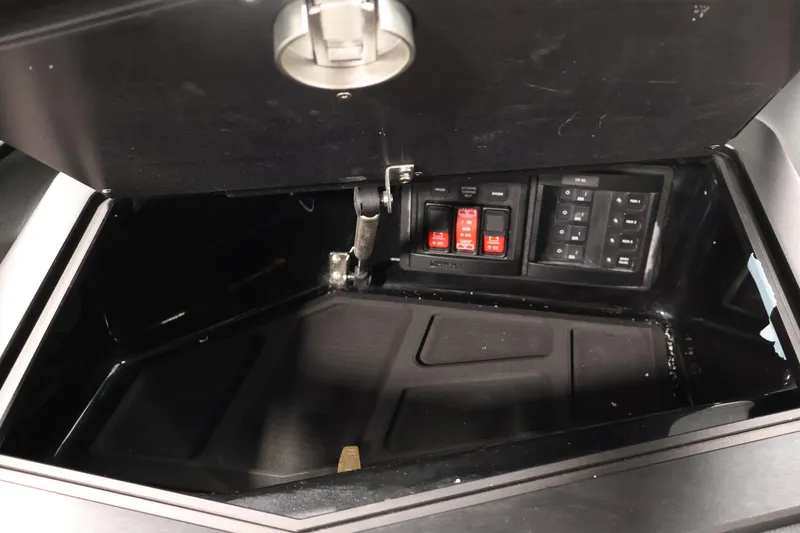 Slide: The Image of Control panel inside a 2026 Centurion Ri245 boat compartment. - 26