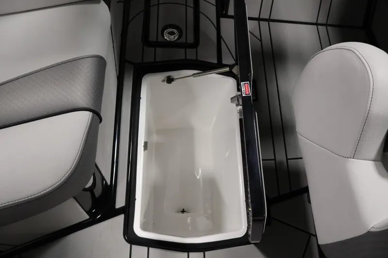 Slide: The Image of Interior storage compartment of 2026 Centurion Ri245 boat, featuring sleek seating and modern design. - 28