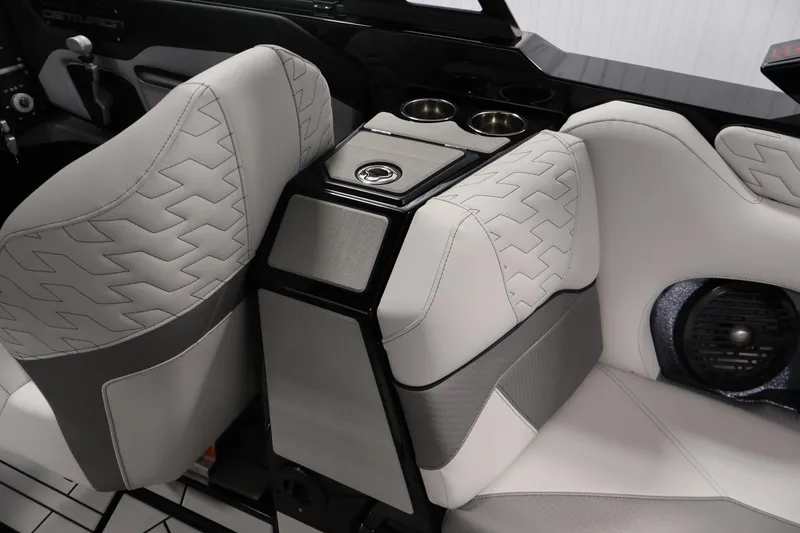 Slide: The Image of 2026 Centurion Ri245 boat interior with stylish seating and cup holders. - 33
