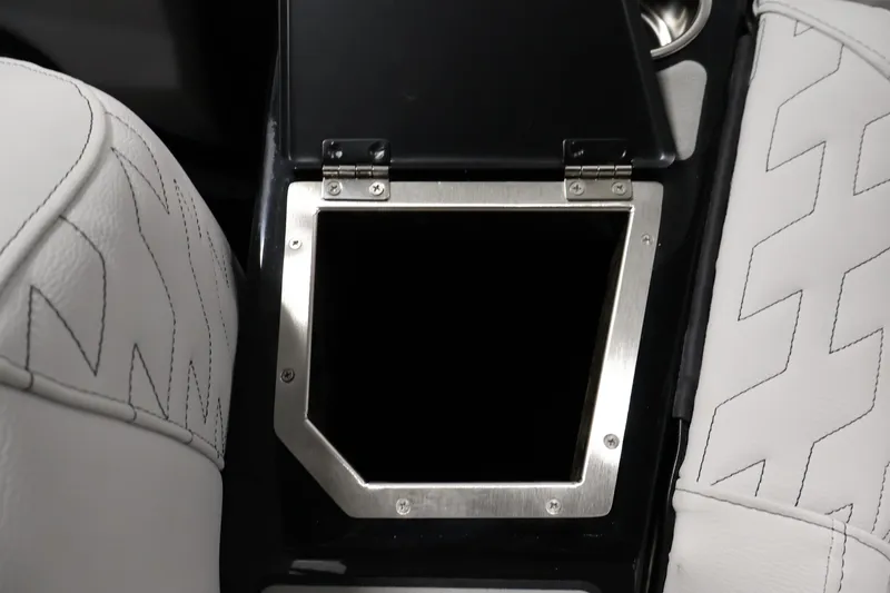 Slide: The Image of Interior of 2026 Centurion Ri245 with open storage compartment and white stitched seats. - 34