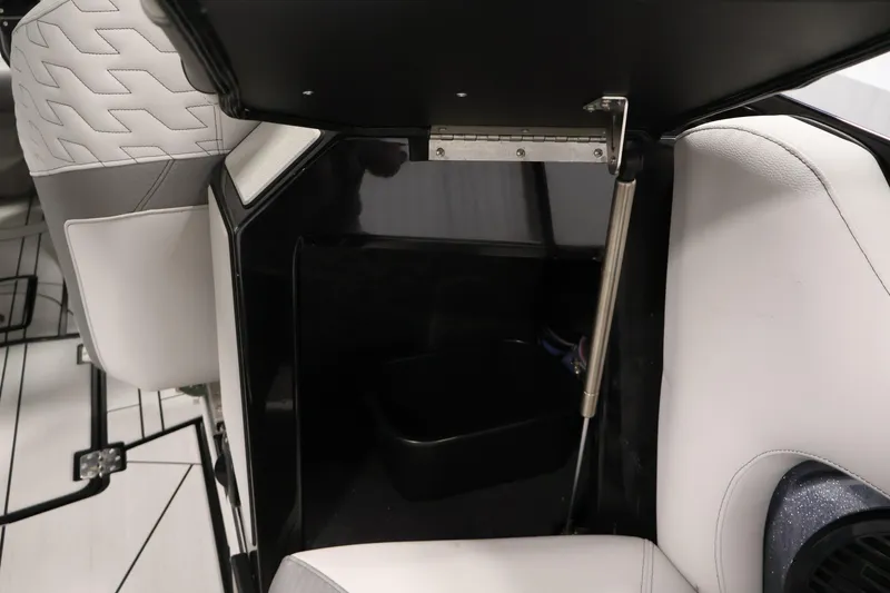 Slide: The Image of Interior storage compartment of 2026 Centurion Ri245 boat with white seating. - 35