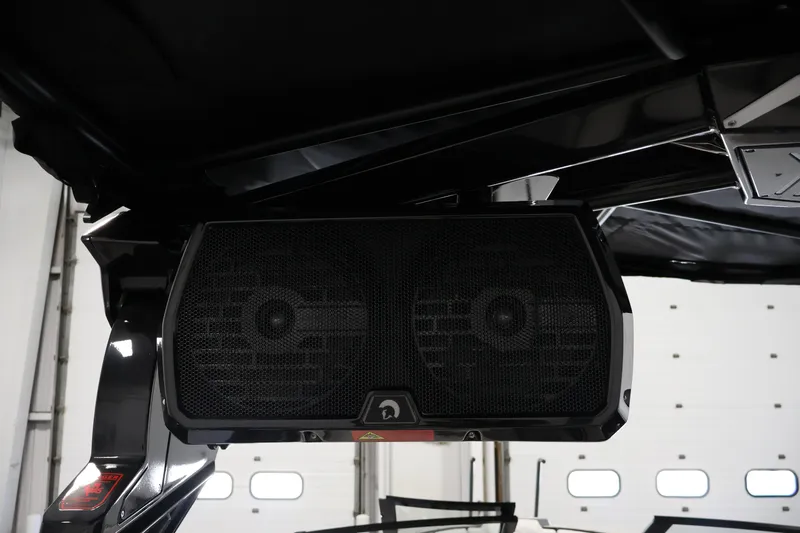 Slide: The Image of 2026 Centurion Ri245 boat speaker system in a garage setting. - 41