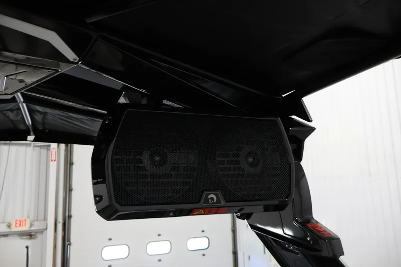 Slide: The Image of 2026 Centurion Ri245 boat speaker system under black canopy. - 42