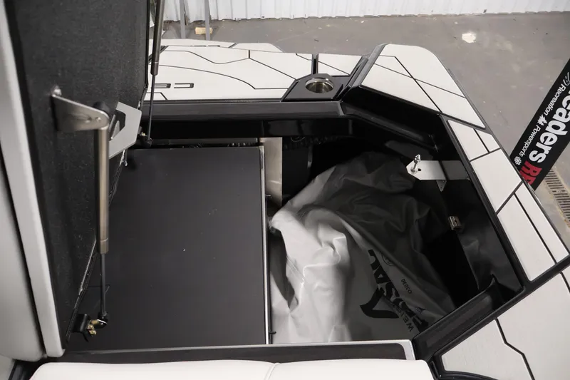 Slide: The Image of 2026 Centurion Ri245 boat storage compartment with sleek design and modern features. - 45