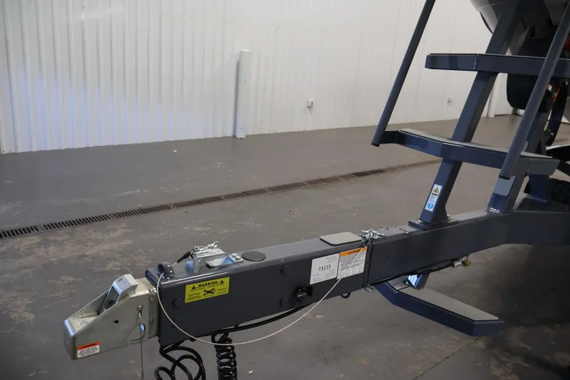 Slide: The Image of Trailer hitch of a 2026 Centurion Ri245 boat in a garage setting. - 47