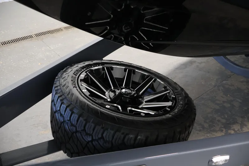 Slide: The Image of 2026 Centurion Ri245 trailer with black alloy wheel and rugged tire. - 49