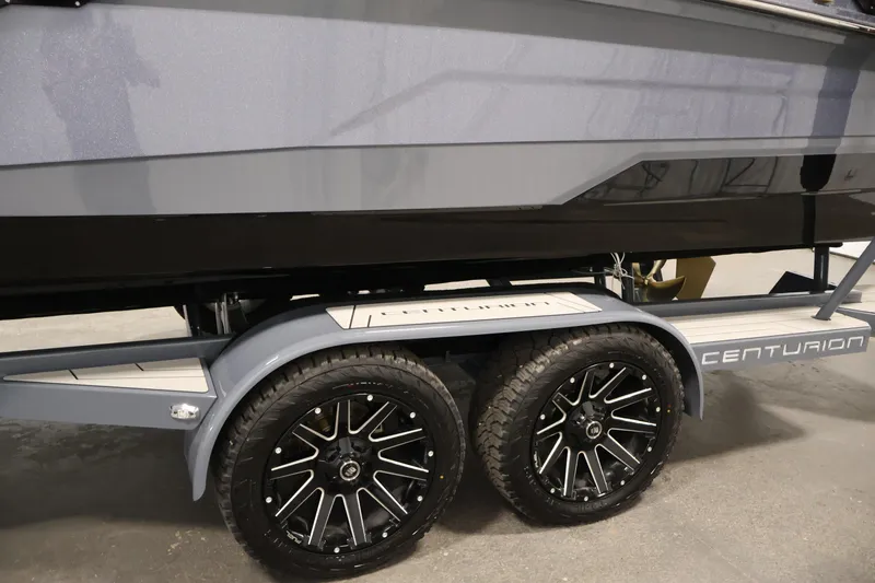 Slide: The Image of 2026 Centurion Ri245 boat trailer with stylish black wheels and sleek design. - 51