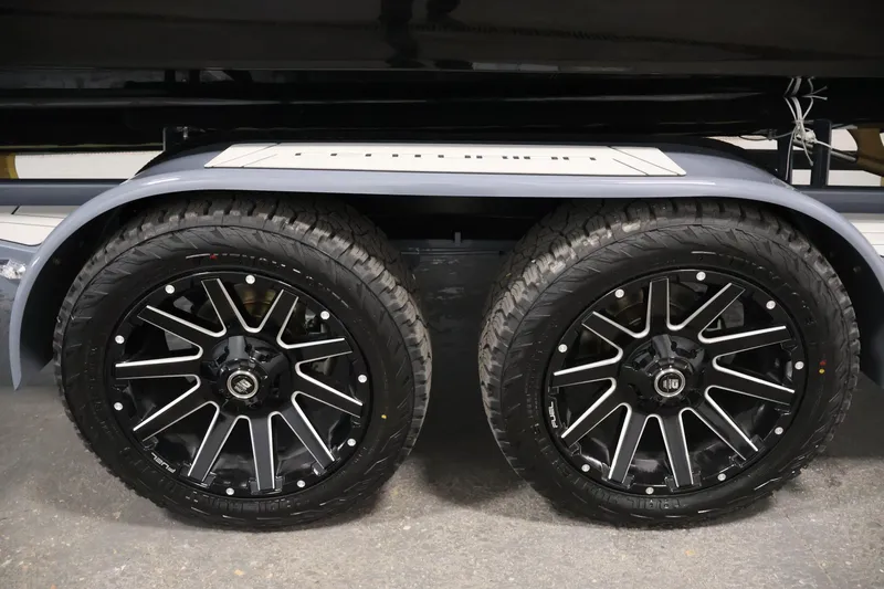 Slide: The Image of 2026 Centurion Ri245 trailer wheels with sleek black rims and rugged tires. - 52