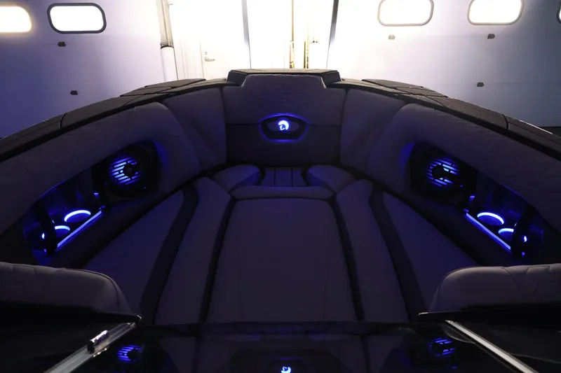 Slide: The Image of Luxurious interior of 2026 Centurion Ri245 boat with ambient blue lighting. - 54
