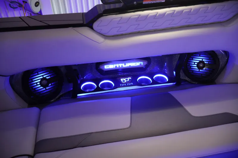 Slide: The Image of Interior of 2026 Centurion Ri245 boat with illuminated speakers and cup holders. - 57