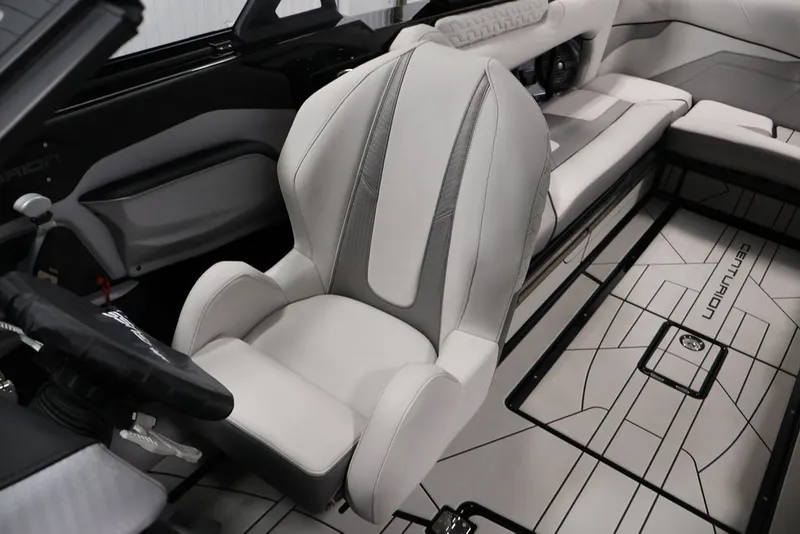Slide: The Image of 2026 Centurion Ri245 boat interior with sleek, modern seating and stylish flooring design. - 21