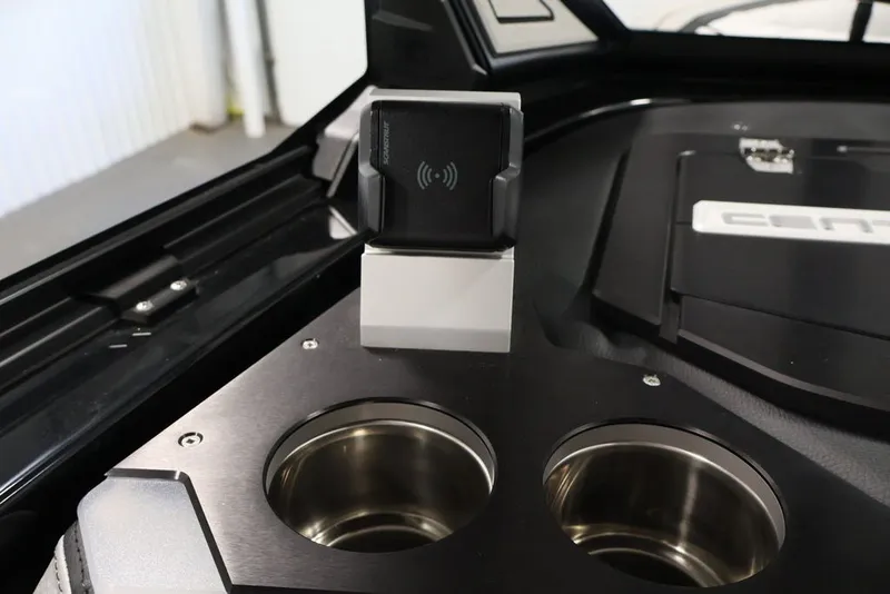 Slide: The Image of 2026 Centurion Ri245 interior with wireless charging pad and stainless steel cup holders. - 34