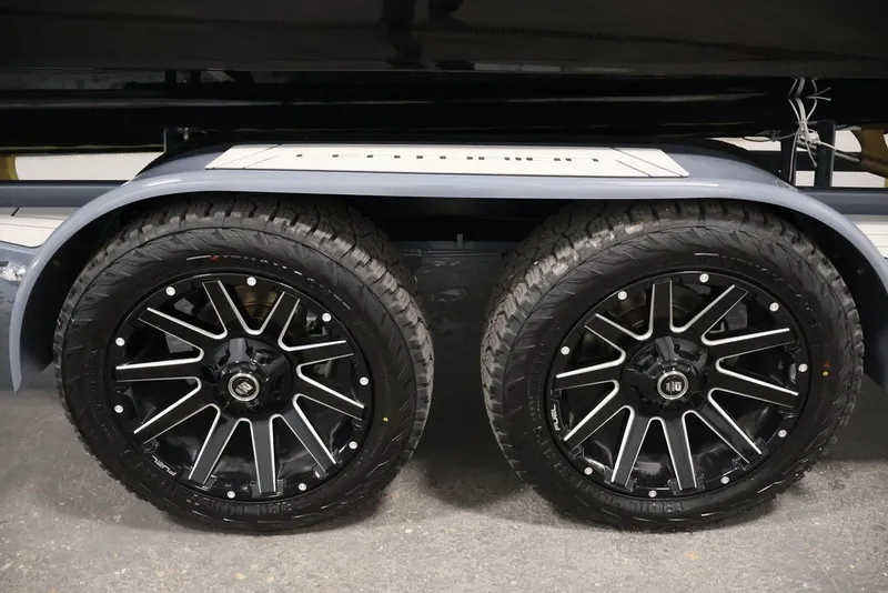 Slide: The Image of 2026 Centurion Ri245 trailer with dual black alloy wheels and rugged tires. - 55