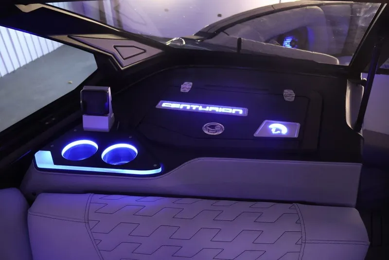 Slide: The Image of Interior of 2026 Centurion Ri245 boat with illuminated cup holders and branding. - 73
