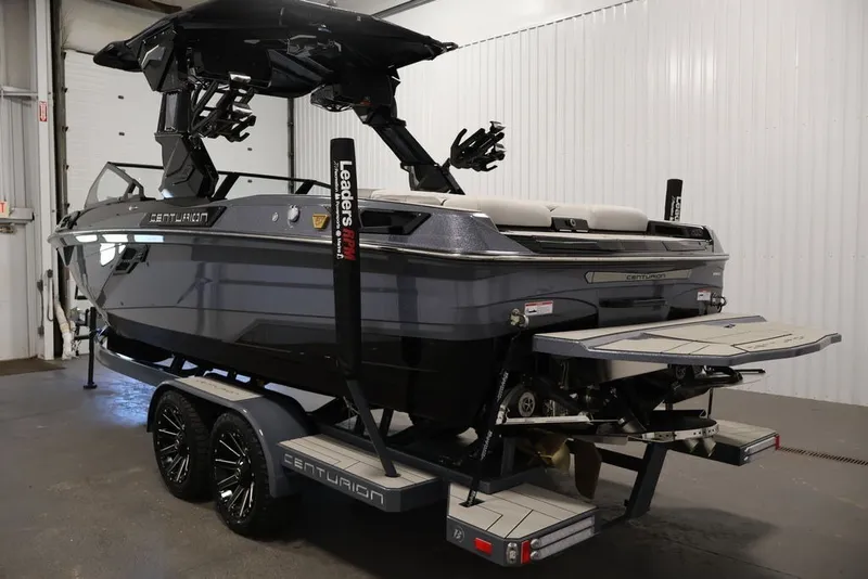 Slide: The Image of 2026 Centurion Ri245 boat in a showroom, featuring sleek design and modern amenities. - 7
