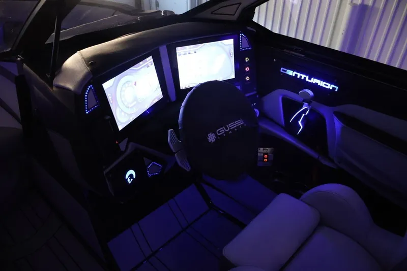Slide: The Image of Futuristic 2026 Centurion Ri245 boat dashboard with illuminated controls and dual screens. - 59