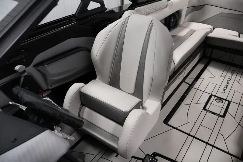 Slide: The Image of 2026 Centurion Ri245 boat interior with sleek, modern seating and stylish design elements. - 12