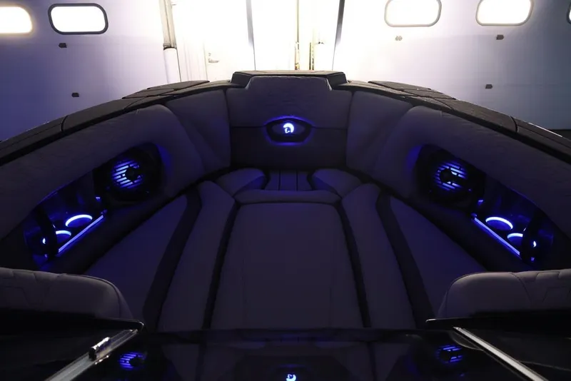 Slide: The Image of Luxurious interior of 2026 Centurion Ri245 boat with ambient blue lighting. - 39