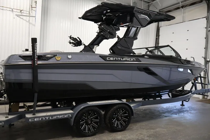 Slide: The Image of 2026 Centurion Ri245 boat on trailer in indoor storage facility. - 3