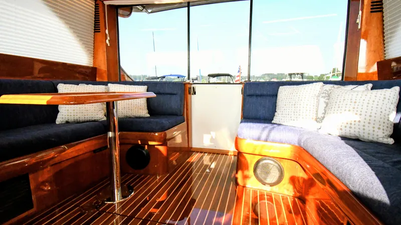 Slide: The Image of Interior of 2022 Hinckley Talaria 43 yacht with elegant wood finish and plush seating. - 4