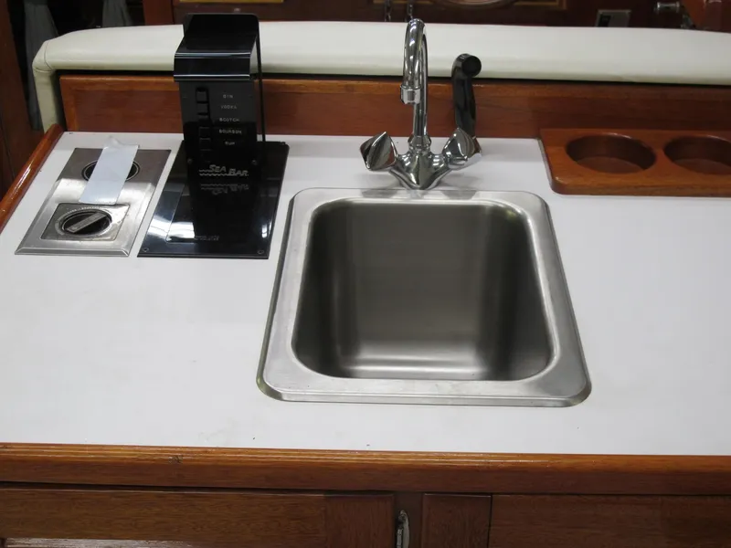 Slide: The Image of 1991 Windsor Craft 310 yacht kitchen sink with faucet and drink dispenser. - 11