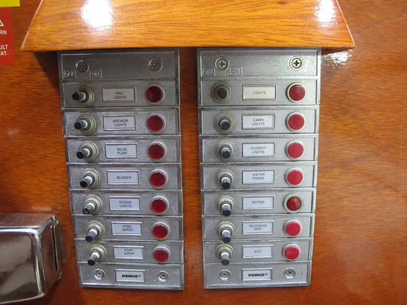Slide: The Image of Control panel of a 1991 Windsor Craft 310 boat with labeled switches and indicators. - 7