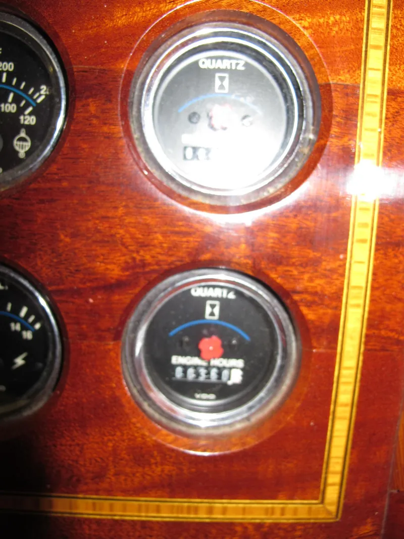 Slide: The Image of Close-up of Windsor Craft 310 1991 dashboard gauges on wood panel. - 8