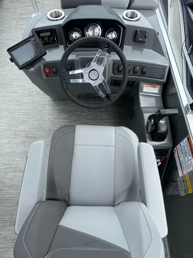 Slide: The Image of 2024 Bennington SV 22 Swingback boat helm with steering wheel and control panel. - 8