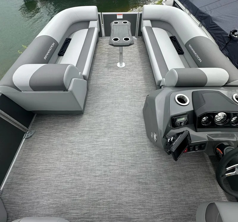 Slide: The Image of 2024 Bennington SV 22 Swingback pontoon boat interior with gray seating and console. - 9