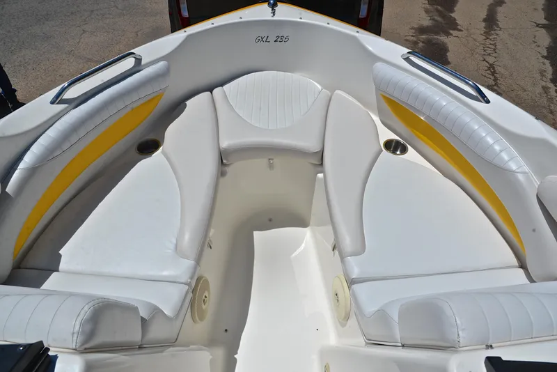 Slide: The Image of 2007 Glastron GXL 235 boat interior with white and yellow seating. - 20