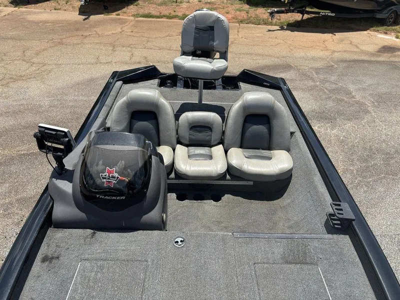 Slide: The Image of 2018 Tracker Pro Team™ 175 TXW boat interior with seating and control panel. - 13