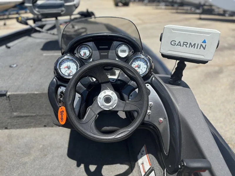 Slide: The Image of 2018 Tracker Pro Team™ 175 TXW boat dashboard with Garmin GPS and steering wheel. - 16