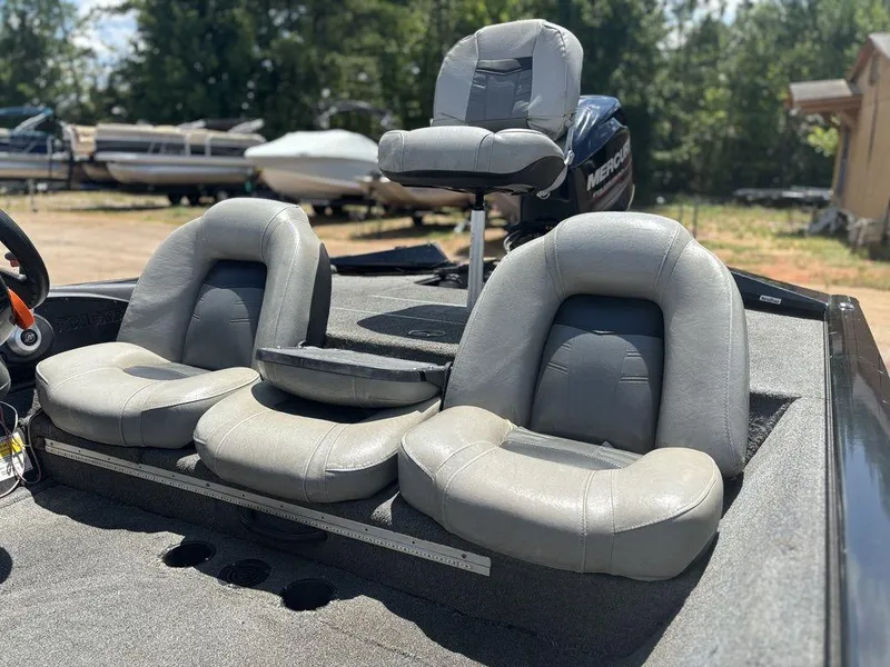 Slide: The Image of 2018 Tracker Pro Team™ 175 TXW boat with gray seating and Mercury engine. - 3