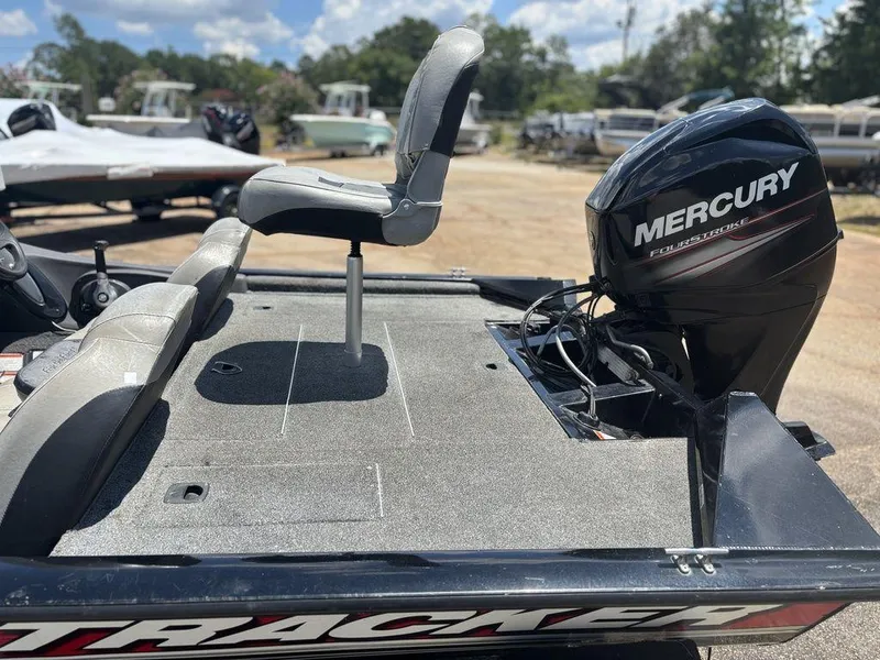 Slide: The Image of 2018 Tracker Pro Team™ 175 TXW boat with Mercury FourStroke engine, parked outdoors. - 7