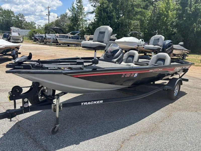 Slide: The Image of 2018 Tracker Pro Team™ 175 TXW boat on trailer, parked outdoors. - 9