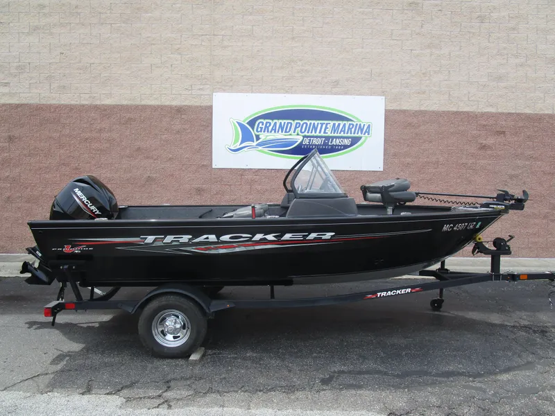 The Image of 2024 Tracker Pro Guide V16 WT boat on trailer at Grand Pointe Marina. - 1