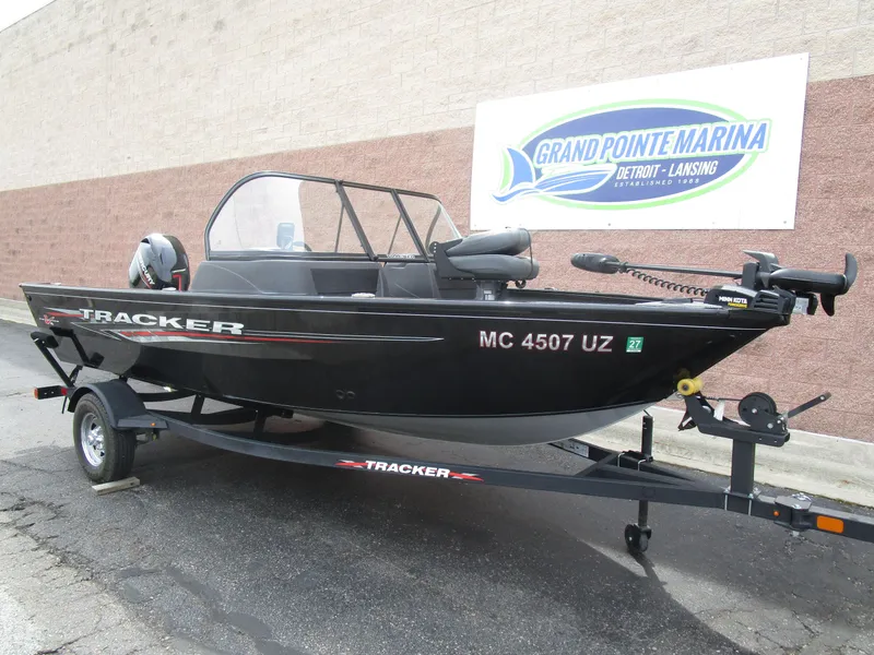 Slide: The Image of 2024 Tracker Pro Guide V16 WT boat on trailer at Grand Pointe Marina. - 3