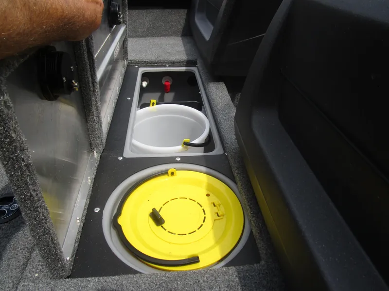 Slide: The Image of 2024 Tracker Pro Guide V16 WT boat storage compartments with yellow and white lids. - 5