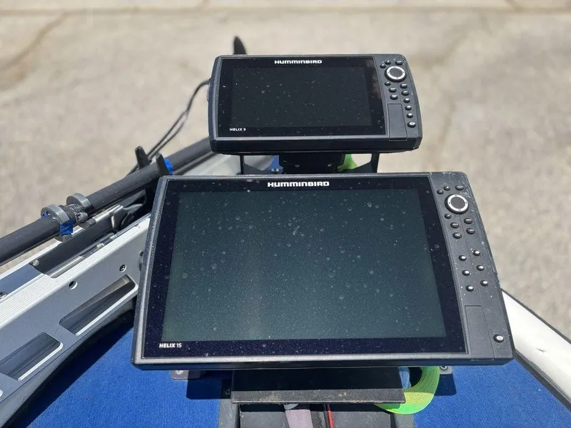 Slide: The Image of Dual Humminbird Helix fish finders on a 2000 Triton TR20 boat dashboard. - 17