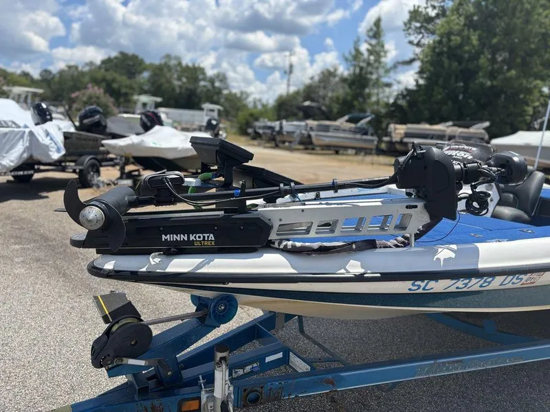 Slide: The Image of Triton TR20 boat with Minn Kota Ultrex motor on trailer, sunny day, 2000 model. - 9