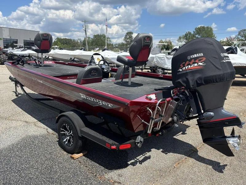 Slide: The Image of 2017 Ranger RT188 boat with Yamaha engine, parked outdoors under a cloudy sky. - 11
