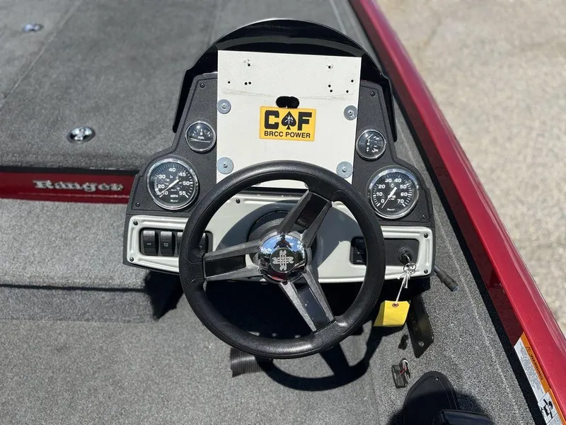 Slide: The Image of 2017 Ranger RT188 boat dashboard with steering wheel and gauges. - 14