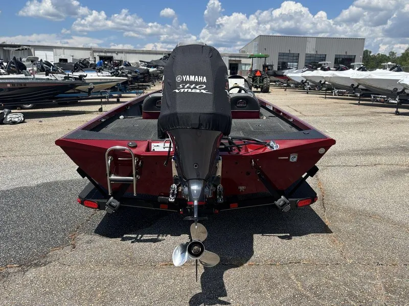 Slide: The Image of 2017 Ranger RT188 boat with Yamaha engine, parked outdoors under a cloudy sky. - 3