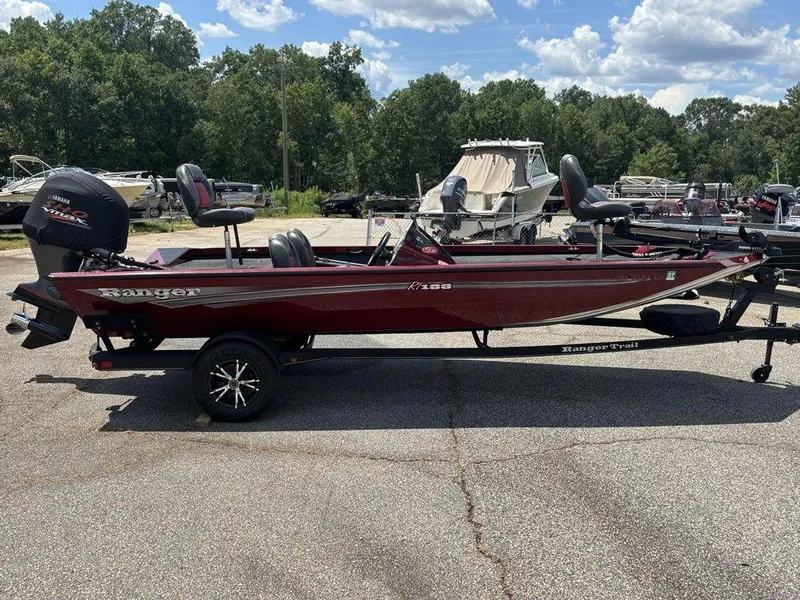 Slide: The Image of 2017 Ranger RT188 boat with Yamaha engine, parked outdoors on a sunny day. - 4