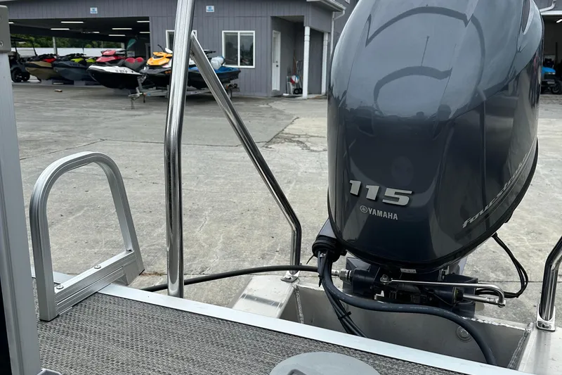 Slide: The Image of 2024 Bennington SV 22 Quad Bench with Yamaha 115 engine at a marina. - 10
